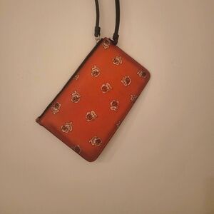 Orange Coach Wristlet with Flower Print